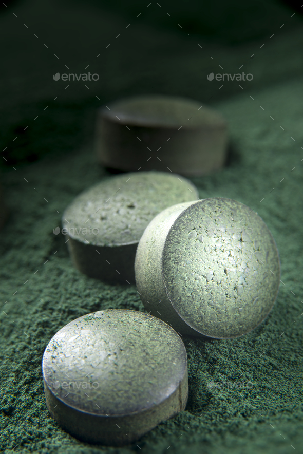 Spirulina Tablets and powder Stock Photo by Olivier_Le_Moal PhotoDune